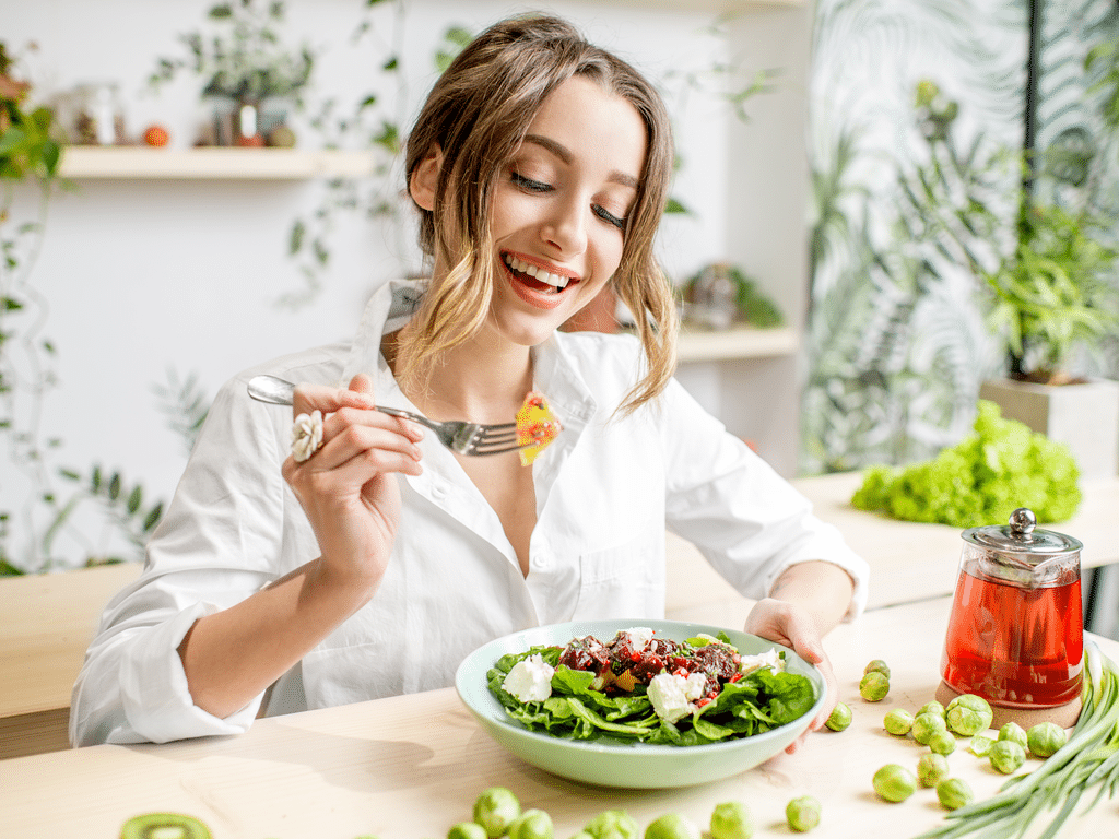 woman eating healthy food sitting in the beautiful interior