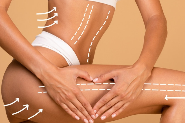 woman with massage lines and arrows on her body touching skin on leg