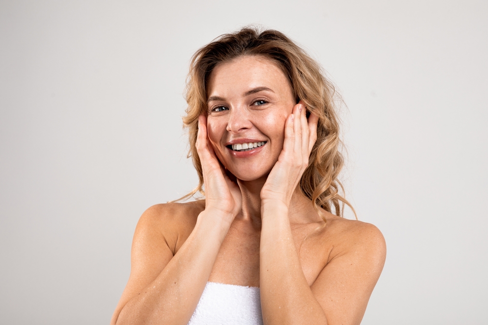 Mature woman with beautiful, glowing skin after anti-aging treatments