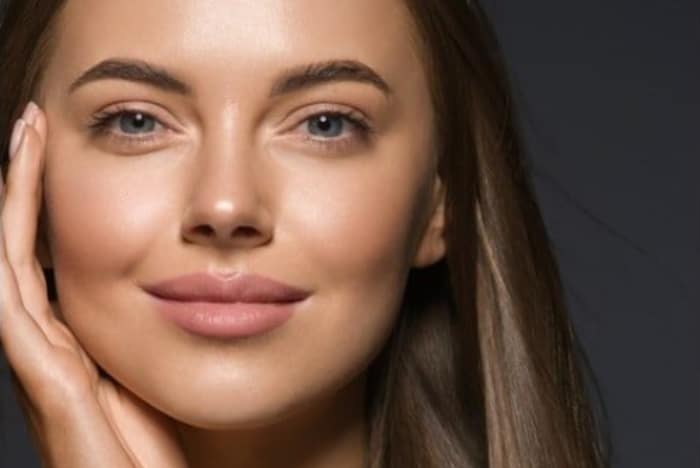 Woman with plump lips is ready for her date thanks to cosmetic treatments.
