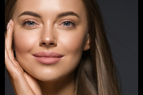 Woman with plump lips is ready for her date thanks to cosmetic treatments.